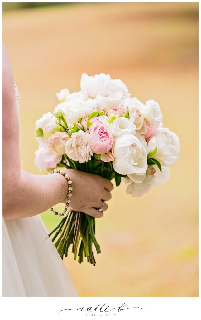 Pastel wedding bouquet featuring peonies and David Austin roses