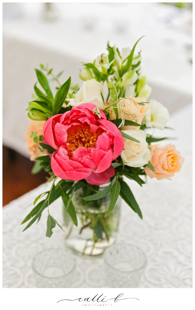 Mason Jar reception flowers featuring peonies and roses